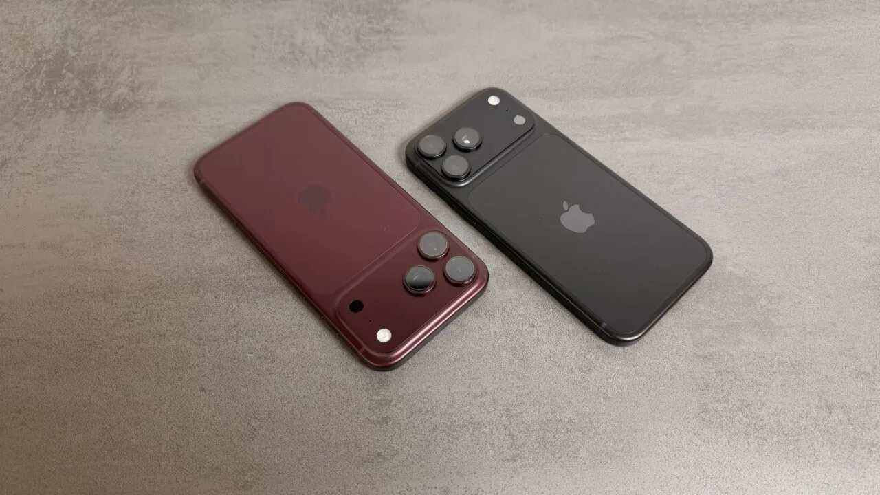 JP Morgan raises its Apple price target despite reported iPhone 18 Pro cuts: two Pro models in burgundy and black seen from the back on a grey stone surface