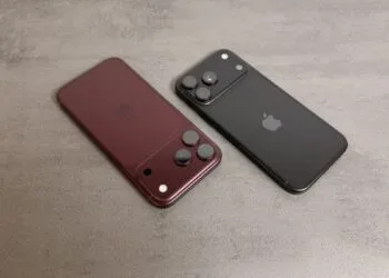 JP Morgan raises its Apple price target despite reported iPhone 18 Pro cuts: two Pro models in burgundy and black seen from the back on a grey stone surface