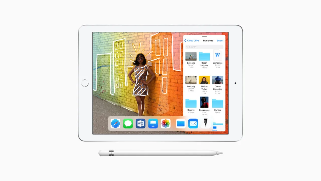 12-inch MacBook obsolete: sixth-generation iPad in silver with Home button, showing a photo with drawings and the Files app, with an Apple Pencil below