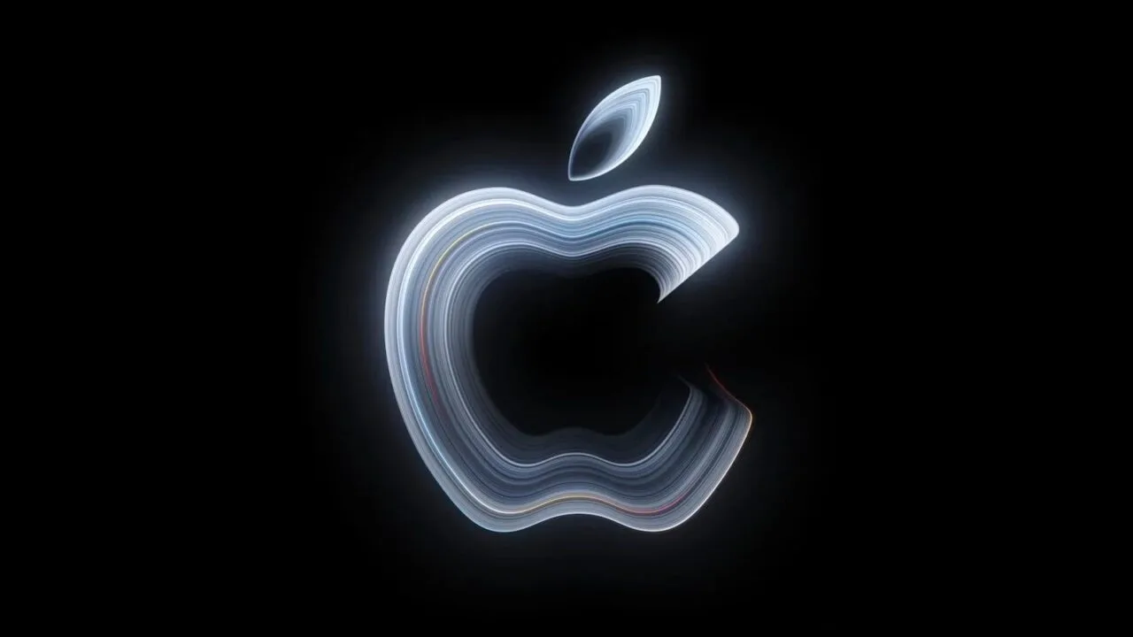 MacBook Pro touchscreen: glowing Apple logo made of curved light lines on a black background