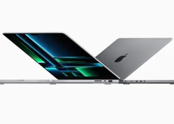 Two open MacBook Pro in silver and space gray, one facing the display – the MacBook Pro is expected to get an OLED display next