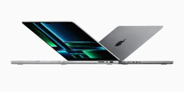 Two open MacBook Pro in silver and space gray, one facing the display – the MacBook Pro is expected to get an OLED display next