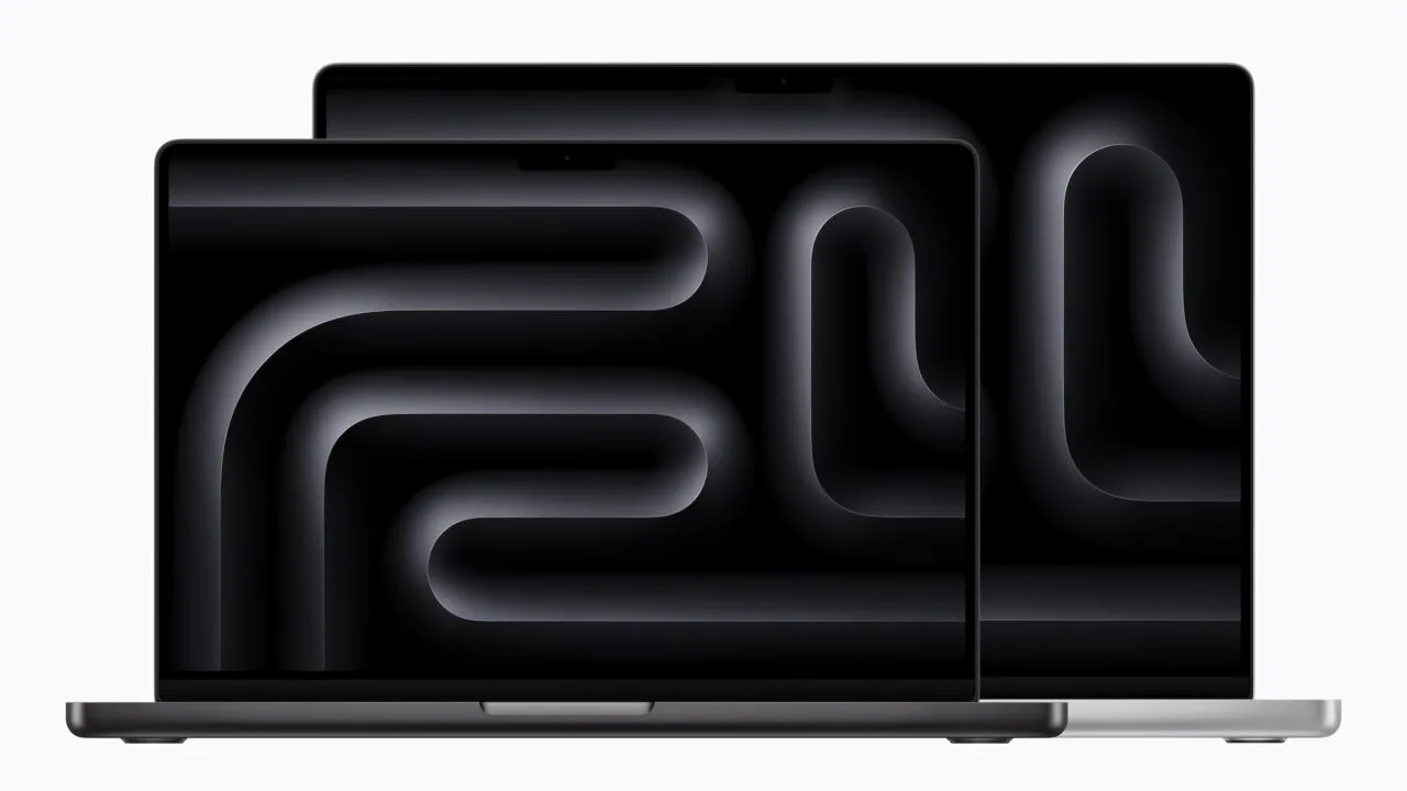 Two open MacBook Pro models in Space Black and Silver with a notch at the top of the display, the current design ahead of the MacBook Pro touchscreen