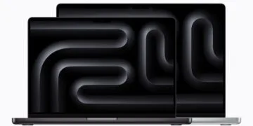 Two open MacBook Pro models in Space Black and Silver with a notch at the top of the display, the current design ahead of the MacBook Pro touchscreen