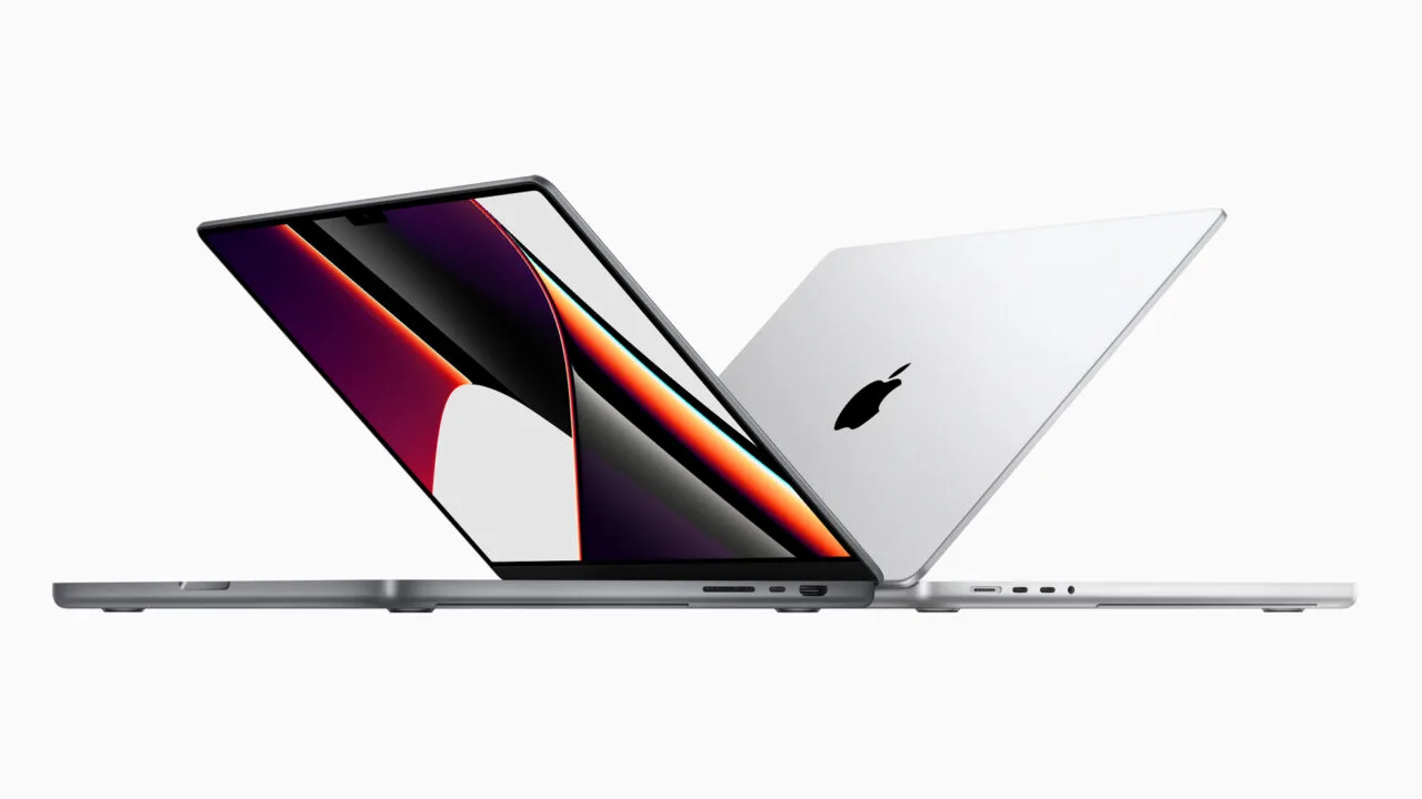 MacBook Pro touchscreen: the current MacBook Pro in space gray and silver, open one behind the other