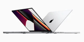 MacBook Pro touchscreen: the current MacBook Pro in space gray and silver, open one behind the other