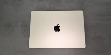 Closed silver MacBook seen from above on a grey stone surface, ahead of the MacBook Ultra with OLED touch display, which has not yet been announced