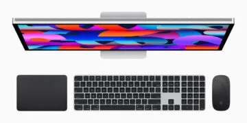 Magic Mouse Intel Macs: Studio Display from above with Magic Trackpad, Magic Keyboard and Magic Mouse in black