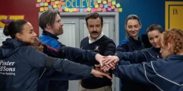 Ted Lasso season 5: Ted Lasso joins hands with the AFC Richmond women's team beneath the Believe sign